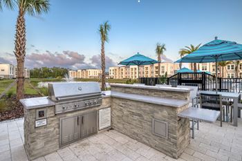 Outdoor gathering area with grilling station & fire pit